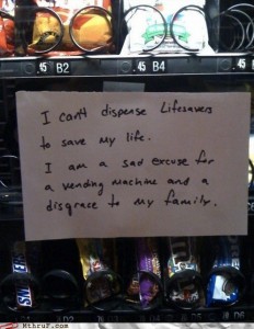 photo of bad vending machine with sign